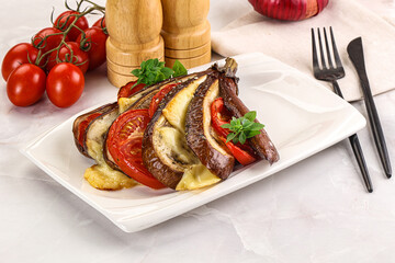 Baked tomato with mozzarella and tomato
