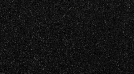 A texture background of slightly textured black color paper, showcasing a mid-level granularity that mimics the look of colored construction paper