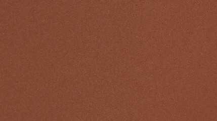 Fototapeta premium A texture background of slightly textured cocoa brown color paper, showcasing a mid-level granularity that mimics the look of colored construction paper