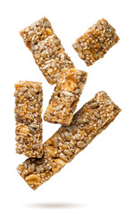 Kozinaki pieces flying on white background. Isolated