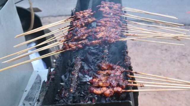 grilled satay on a charcoal grill
