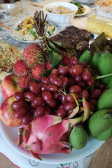 Seasonal tropical fruits on a plate, a dish for Chinese New Year