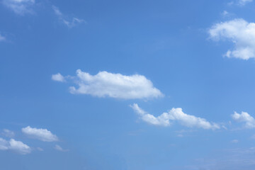 Sky background with white clouds on a bright day