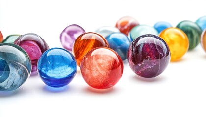 Colorful marbles scattered on a white surface capturing light and reflections