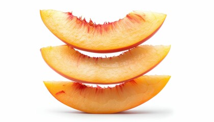 Slices of a ripe peach stacked on a white background in a simple arrangement