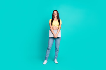 Full body portrait of nice young woman hold laptop wear top isolated on turquoise color background