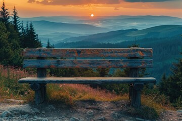 Obraz premium Wooden Bench Overlooking Mountain Sunset