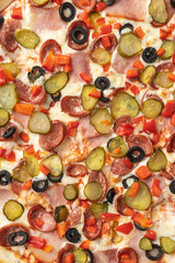the macro composition of pizza for the menu. fresh ingredients are cheese, ham and tomatoes.