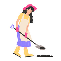 A young woman in garden clothes digs the ground with a shovel