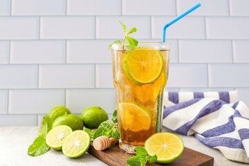 Iced Lemon Tea , iced with lime tea on white brick backgrounf
