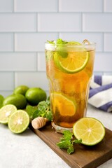 Iced Lemon Tea , iced with lime tea on white brick backgrounf