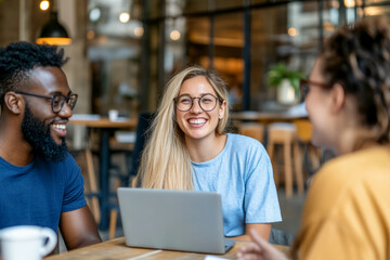 Smiling Team Collaborating in a Modern Cafe
