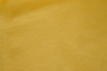 Cotton elastane fabric Ray Flower or Radiant Yellow Color. Blending natural cotton fibers with synthetic elastane fibers. Yellow fabric background.