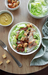 A bowl  of  Caesar salad
