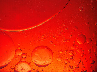 Abstract Background Red oil Macro Colorful artistic of oil drop floating on the water. macro red bubble oil of wallpeper, blood concept