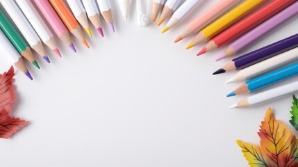 Fototapeta premium A row of colored pencils are arranged in a circle on a white background