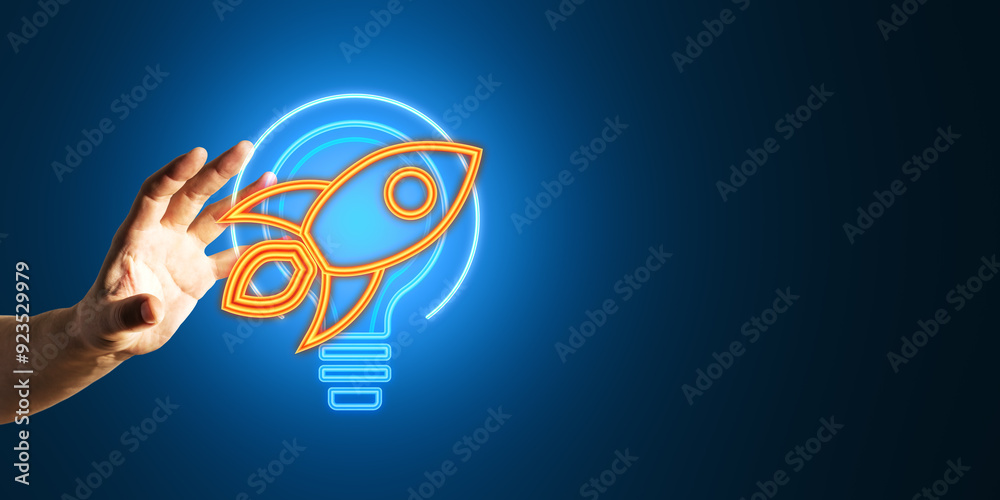 Poster close up of male hand using creative neon light bulb with rocket or spaceship icon on blue backgroun