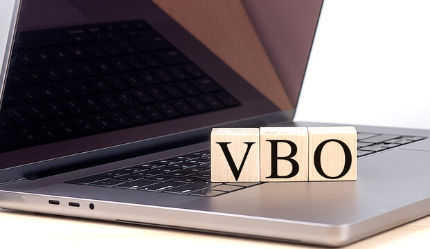 VBO word on wooden block on a laptop , business concept