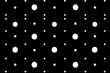 Pattern of white circles scattered on a black background