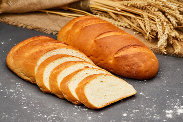 Golden, freshly sliced loaf of homemade bread, perfect for sandwiches, breakfast, or toasting