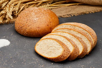 Whole wheat bread loaf sliced, showcasing its hearty texture and rich, wholesome flavor