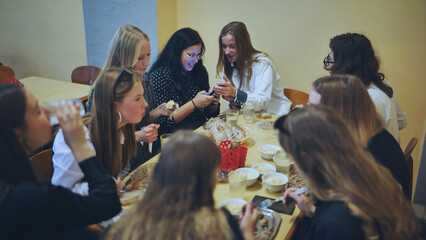 High school students eat in the cafeteria.