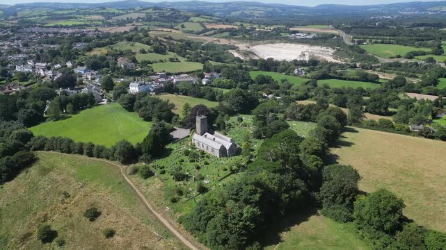 Highweek, South Devon, England: DRONE VIEWS: All Saints Church, Highweek village, ball clay quarry and Dartmoor National Park. The village overlooks the 13th century market town of Newton Abbot (1).