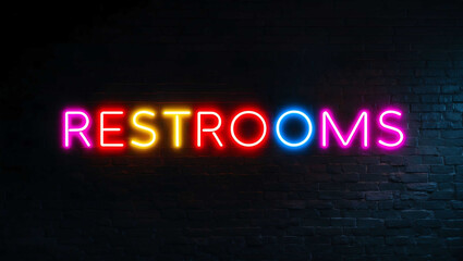 Obraz premium restrooms colorful neon lettering on plain dark black background
