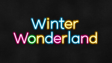 Obraz premium winter wonderland colorful neon lettering on plain dark black background