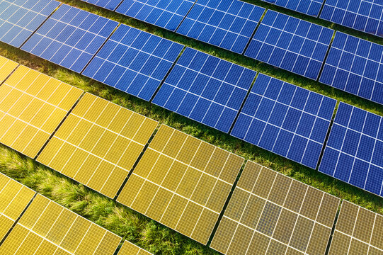 Solar farm superimposed with flag of Ukraine. Symbolizing solar power and panel demand, renewable energy industry, government policy, and sustainability initiatives in the country.