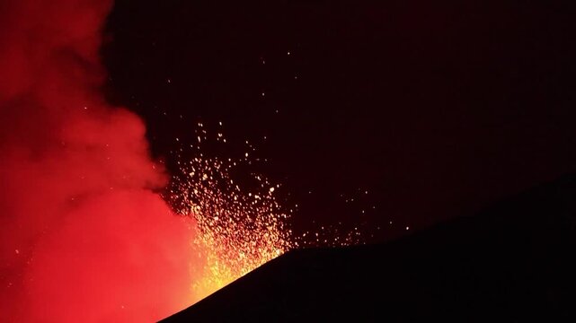 Etna Volcano eruption in the night with greatest lava explosion from top crater - Sicily