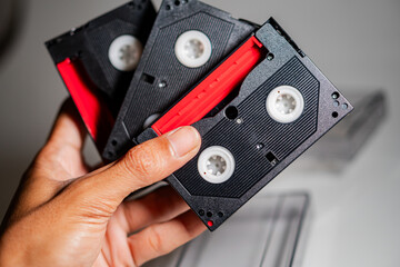 Hand Holding Vintage VHS Tapes