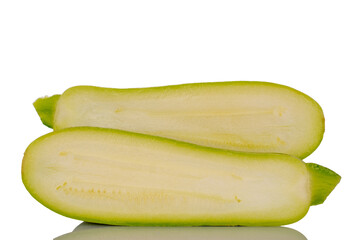 Two halves of ripe zucchini, macro, isolated on white background.
