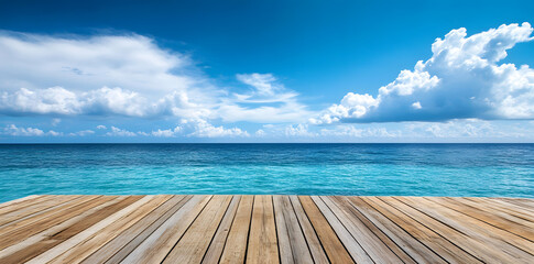 Fototapeta premium Wooden deck in front of clear blue ocean with clouds in the sky
