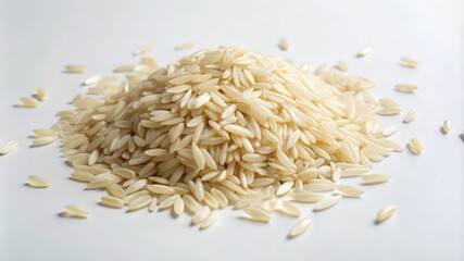 Obraz premium Pile of Uncooked Long Grain Rice on White Surface