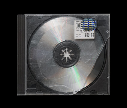 Cracked, smashed, damaged cd case isolated on black background. cd mockup
