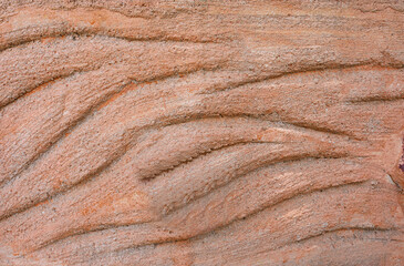 Close-up of a textured, rough stone surface with a hint of desert-like patterns