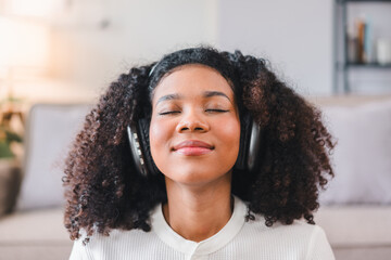 Close-up of African American Woman Relaxing with Headphones.