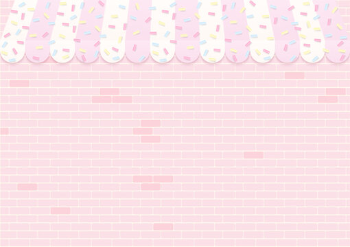 Bakery shop with sugar sprinkles on brick wall background