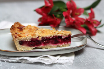 Slice of homemade berry pie on a plate. Selective focus.