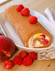 Homemade, peach and raspberry chocolate roll.