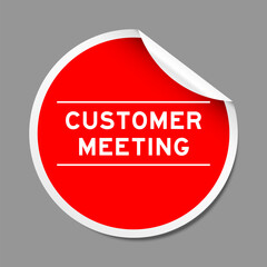 Red color peel sticker label with word customer meeting on gray background