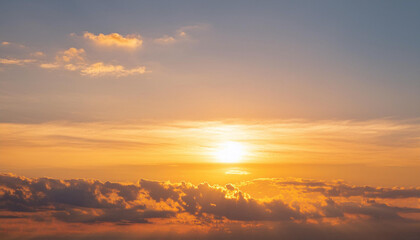 Obraz premium Sun Setting Over Clouds in Sky and Copy Space