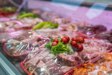 Meat products in store refrigerator, food safety concept