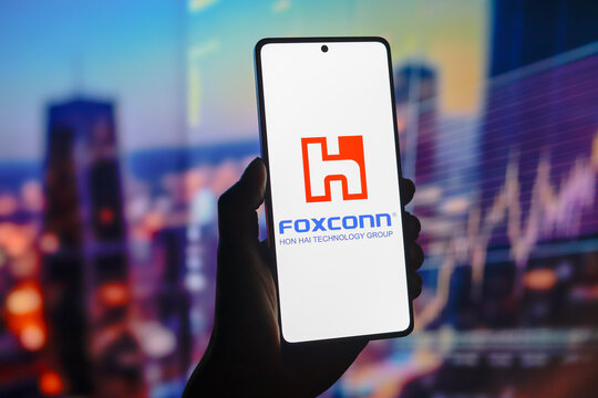 August 15, 2024, Paraguay. In this photo illustration, the Foxconn Technology Group (Hon Hai Precision Industry) logo is displayed on a smartphone screen.