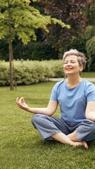 A Tranquil Woman Engaged in Meditation Amidst a Beautiful and Lush Green Garden Space