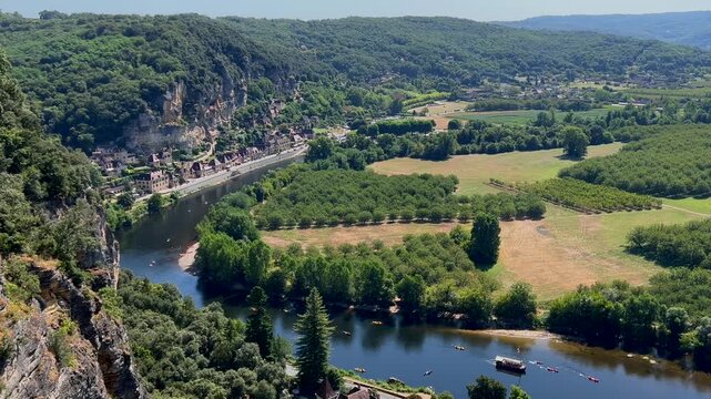 Kayaking at Dordogne river, in La Roque-Gageac, in the Perigord, France. High quality 4k footage