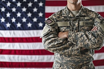 Fototapeta premium A Soldier Standing Before an American Flag with Arms Crossed