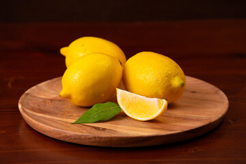Lemons on a wooden plate