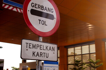 selective focus toll gates or toll payment points in Indonesia during the day